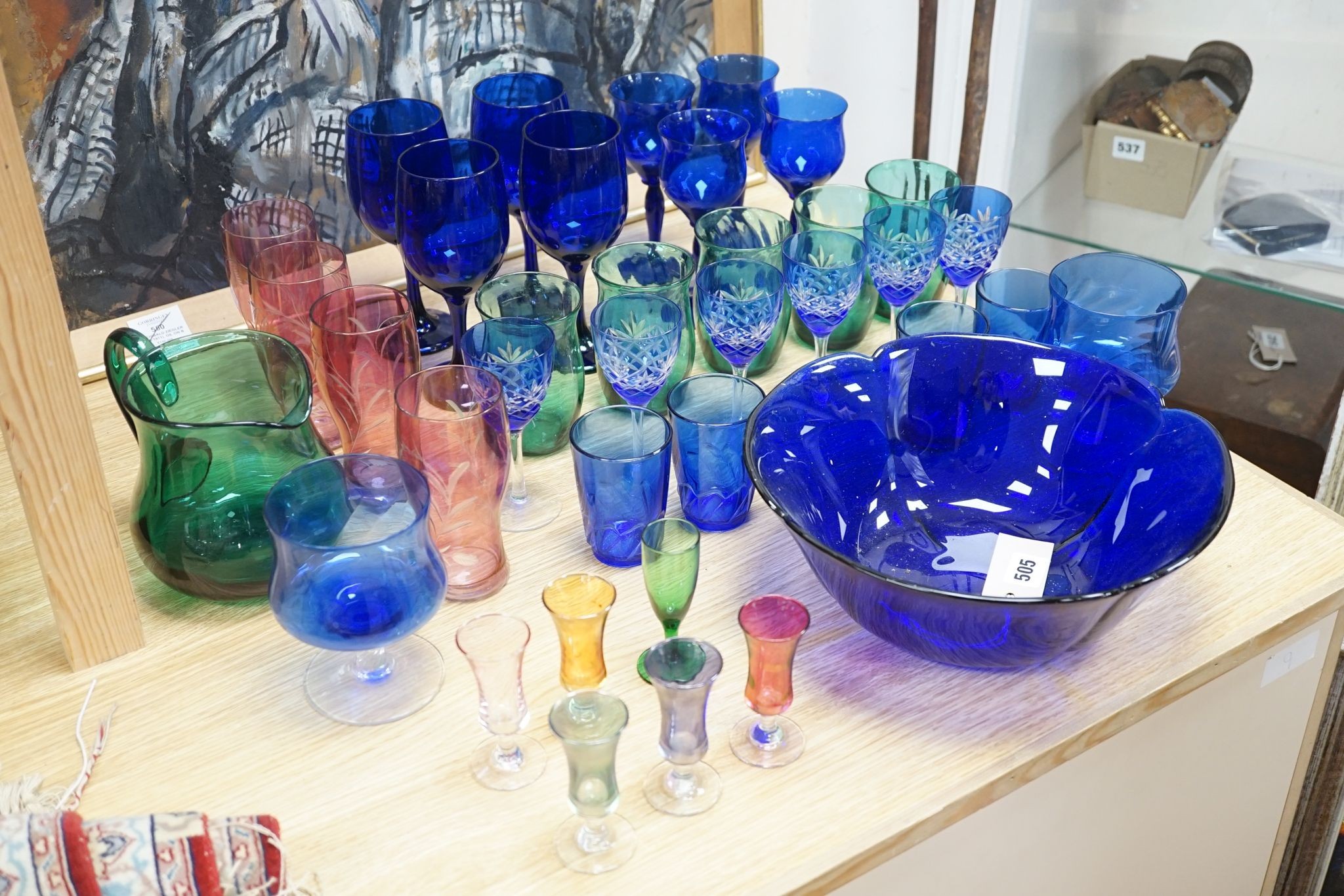 A mixed group of coloured glassware